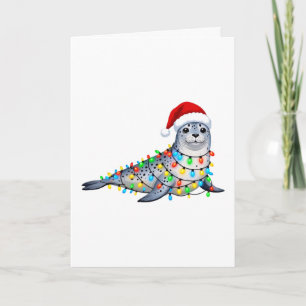 Feestelijke zeehond bedekt met kerstlichtjes kaart