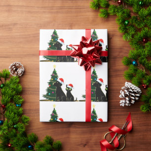 Feestelijke Zwarte Kat en Hond met Kerstmannenmuts Cadeaupapier