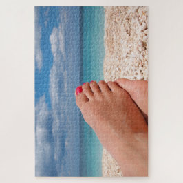 Feet met nagellak op het strand legpuzzel