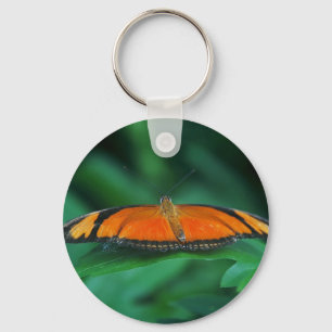 Felle oranje en zwarte vlinder op blad sleutelhanger