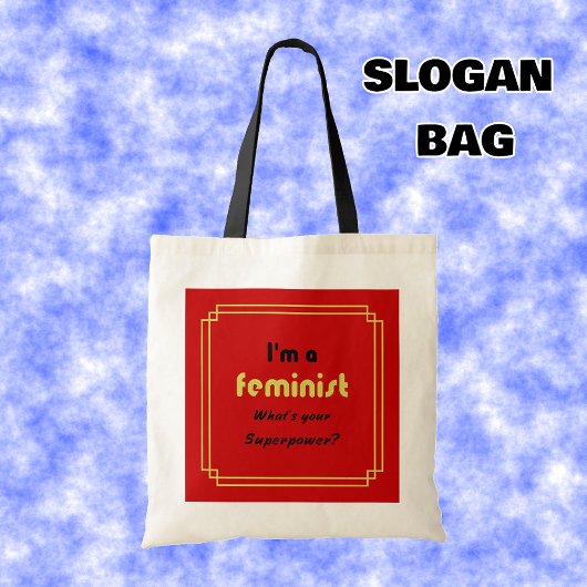 Feministische supermacht slogan zwart op rood tote bag