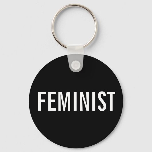 Feministische, vetgedrukte witte tekst op zwarte s sleutelhanger (Voorkant)