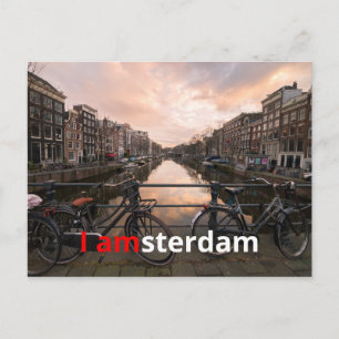 Fietsen bij zonsondergang in Amsterdam Briefkaart