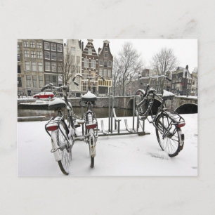 Fietsen in sneeuwAmsterdam in Nederland Briefkaart