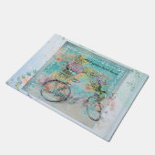 Fietsen met bloemmanden op blauwe schoot deurmat (Schuin)