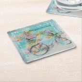 Fietsen met bloemmanden op blauwe schoot kartonnen onderzetters (Schuin)