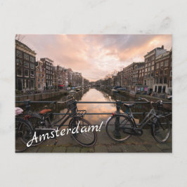 Fietsen op zonsondergang in Amsterdam Briefkaart