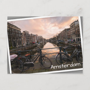 Fietsen op zonsondergang in Amsterdam Briefkaart