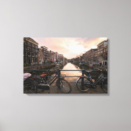 Fietsen op zonsondergang in Amsterdam Canvas Afdruk