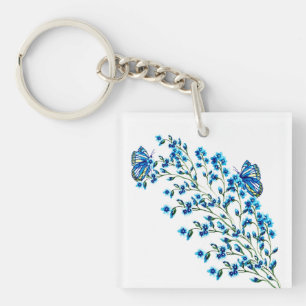 Fijne blauwe bloemen met vlinder sleutelhanger
