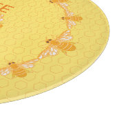 Fijne honingbijen op gele honingraat snijplank (Hoek)