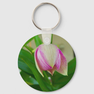 Fijne witte en paarse orchidee op een sleutelhange sleutelhanger