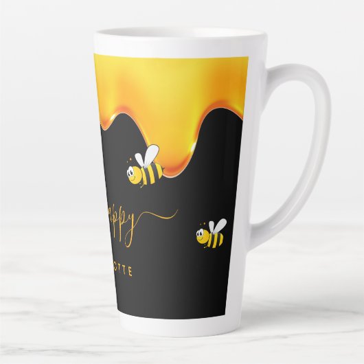 Fijne zwarte schattige hommels die honing druppele latte mok (Rechts)