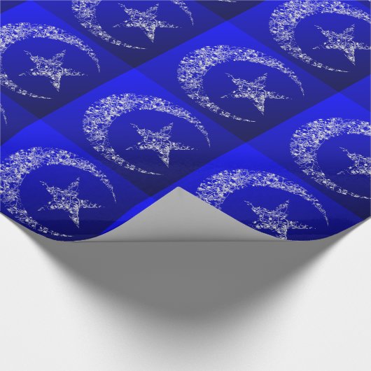 Filigraan halve maan en ster op blauw cadeaupapier (Hoek)