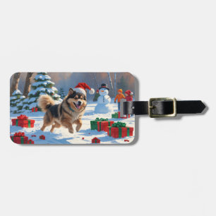 Finse Lapphond loopt door sneeuw met Kerstmuts Bagagelabel