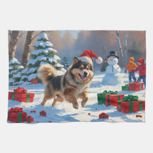 Finse Lapphond loopt door sneeuw met Kerstmuts Theedoek