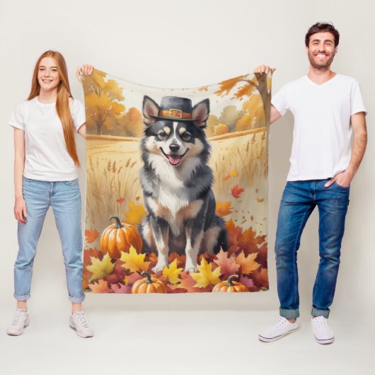 Finse Lapphund in de herfst verlaat de Thanksgivin Fleece Deken (In situ)