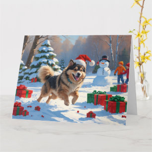 Finse Lapphund loopt door de sneeuw met Kerstmuts Kaart