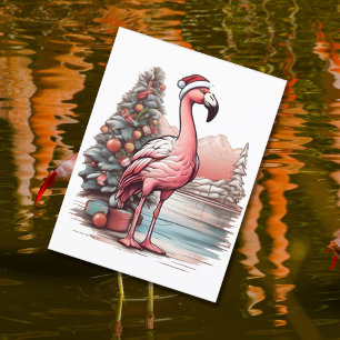 Flamingo met kerstmuts naast de kerstboom briefkaart