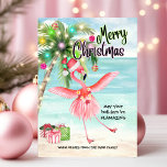 Flamingo Palm Tree Tropical Beach Kerstmis Feestdagenkaart<br><div class="desc">Stuur uw warmste vakantie groeten met deze tropische kerstkaart! Met een speelse roze flamingo dansen onder een palmkerstboom bij het zee, brengt dit ontwerp strandachtige vakantie vibes tot leven. Perfect voor iedereen die sneeuw voor zand wil ruilen dit vakantieseizoen, deze kaart is de perfecte manier om vrienden en familie een...</div>