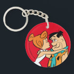 Flintstenen | Wilma Kissing Fred Sleutelhanger<br><div class="desc">Kijk naar Wilma die binnenleuning om Fred te kussen.</div>