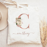 Floral Ivory Roos Gold Monogram Letter C Tote Bag<br><div class="desc">Deze elegante canvas tas heeft een groot letter "C"-monogram in de folie van faux-roos goud, versierd met een ivoor floral bouquet, getrimd met groen en roos goudbladerblauw. Pas het met haar naam in het handschrift van het roos gouden handschrift aan, met bloeit aan het begin en eind. Maakt een perfect...</div>