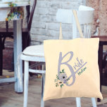 Floral Letter Dusty Blue Personalized Bride Tote Bag<br><div class="desc">Gepersonaliseerde canvas tas voor de Bride met hoofdletter B, versierd met waterverf bloemen. Het ontwerp heeft een stoffig blauw kleurenthema en de naam sjabloon is opstelling klaar voor u om het met jouw naam aan te passen. Perfect voor bachelorette weekends, trouwrepetities en de grote dag. Coördinatiezakjes zijn ook beschikbaar voor...</div>