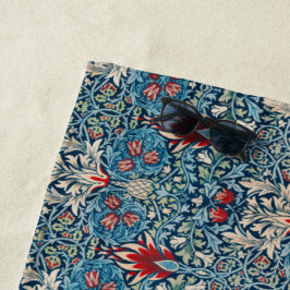 Floral pattern on green leaves blue background strandlaken