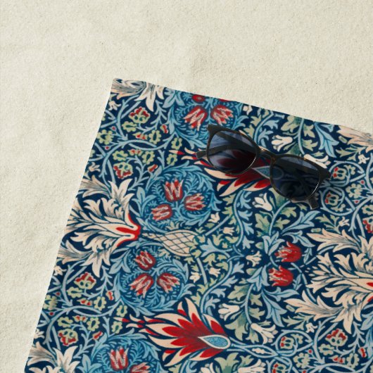 Floral pattern on green leaves blue background strandlaken (In situ)