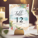 Floral Waterverf Beach Scene Summer Wedding Kaart<br><div class="desc">Breng uw gasten naar een paradijs aan zee met deze romantische tafelnummers. Met een waterverf scène van zacht roze en wit bloeit tegen een dromerige strandachtergrond,  deze kaarten creëer een rustige en uitnodigende sfeer voor uw speciale dag. Personaliseer met uw tafelnummers voor een unieke touch die uw kustthema aanvult.</div>
