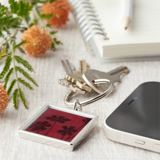 Flowerhead Silhouettes op Crimson Background Sleutelhanger (Zijkant)