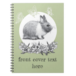 Fluffy hare met vlinders op groene achtergrond notitieboek