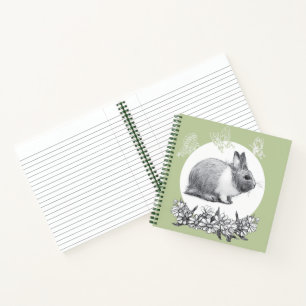 Fluffy hare met vlinders op groene achtergrond notitieboek
