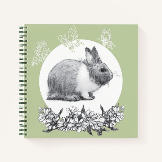 Fluffy hare met vlinders op groene achtergrond notitieboek (Voorkant)