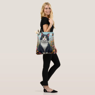 Fluffy kat in de tuin tote bag