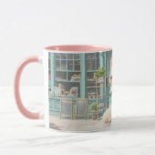 Fluffy kitten met blauwe boog bij banketbakkerij mok (Links)