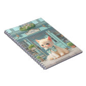 Fluffy kitten met blauwe boog bij banketbakkerij notitieboek (Rechterzijde)