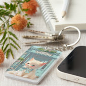 Fluffy kitten met blauwe boog bij banketbakkerij sleutelhanger (Voorkant Rechts)