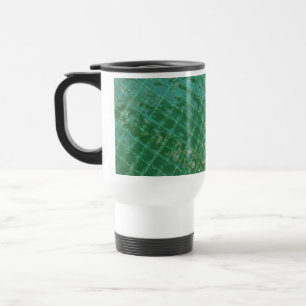 Foto afbeelding van een groen plastic kapje. reisbeker