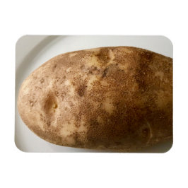 Foto van een bruine aardappel op een witte bord magneet