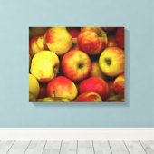 Foto van een Bushel van gele en rode appels Canvas Afdruk (Insitu (Houten vloer))