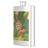 foto van een vlinder op een bloem heupfles (Links)