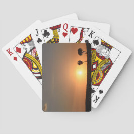 Foto van een zonsondergang op het strand  pokerkaarten