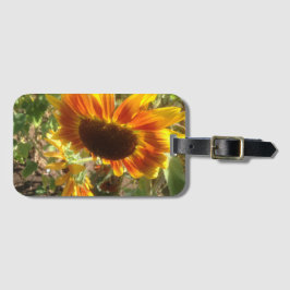 Foto van gele en oranje zonnebloemen bagagelabel