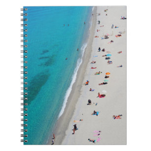 Foto van uitzicht van vogelaars op het strand notitieboek