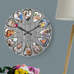 Foto's van het hart Rustic Grey Wood Large Clock Grote Klok<br><div class="desc">Creëer uw eigen meerfotoklok. Het fotomalplaatje is opstelling voor u om 12 foto's toe te voegen die in een hart gevormd lijst worden getoond. Het ontwerp gebruikt de verticale foto's van het portret voor alle aantallen behalve 3 en 9 die in landschapshorizontaal formaat zijn. Het klokgezicht heeft eenvoudige getallen met...</div>