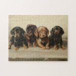 Four Dachshund Puppies | Carl Reichert Legpuzzel<br><div class="desc">Four Dachshund Puppies | Carl Reichert’s Four Dachshund Puppies is an enchanting painting that captures the innocence and charm of four small dachshund puppies. Rendered in neutral earth tones, the artwork highlights their soft fur and expressive faces, showcasing Reichert’s exceptional skill in creating lifelike animal portraits. The harmonious composition and...</div>