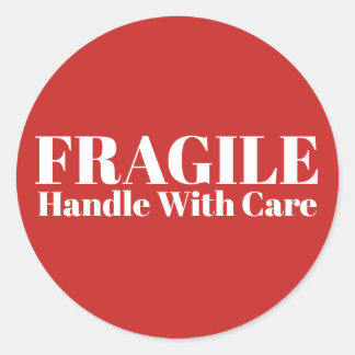 Fragile handgreep met zorg ronde sticker