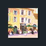 Franse Cafe Canvas Afdruk<br><div class="desc">Mooie doek van een Franse stad met mensen die in een café in de openlucht eten. Kunstwerk van REIFSNYDER</div>