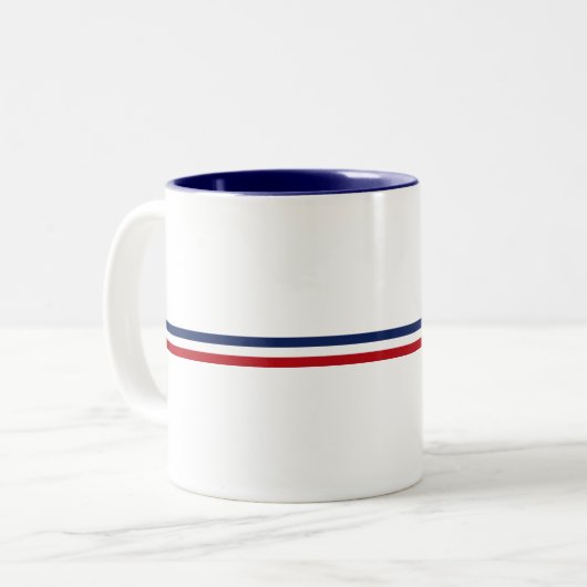 Franse slogan "Impossible n'est pas Français" Tweekleurige Koffiemok (Voorkant links)